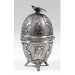 An early 20th Century Russian silvery metal egg pattern ornament surmounted by an eagle with