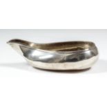 A William IV silver oval pap boat, 5ins overall, makers mark possibly H.L. and C.L, London 1833 (