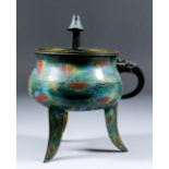 A late 19th Century Chinese bronze and cloisonné tripod censer with curved handle issuing from the