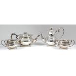 An Elizabeth II silver four piece tea and coffee service of bulbous form, the shaped and moulded
