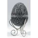 An early 20th Century Russian silvery metal, niello and filigree work egg pattern box, the