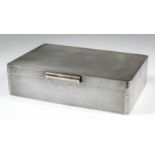 An Elizabeth II silver cigar box with rounded corners and engine turned ornament, with gilt and