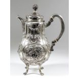 A Continental silvery metal baluster shaped hot water pot, the whole embossed with putti in a