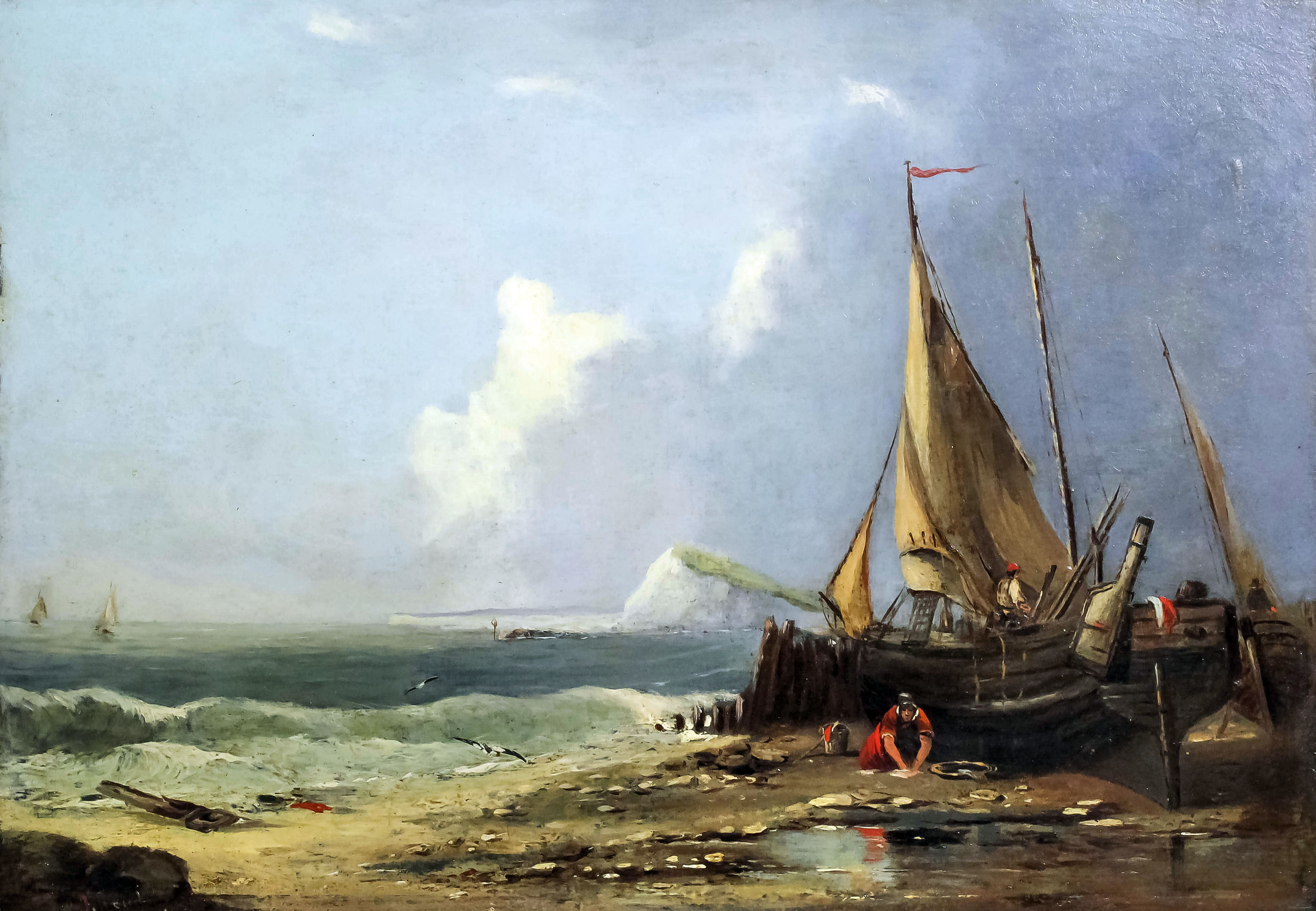A 19th Century English school - Beach scene with fishing boats and chalk headland to distance,