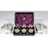 A set of six Victorian silver trefoil-shaped salts with bead mounts and on three ball pattern