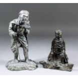 A Japanese silvered metal standing figure of a traveller with a monkey on his back, 9.5ins (24.