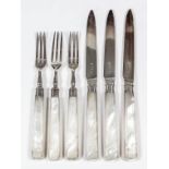 A set of twelve George V silver and mother-of-pearl handled fruit knives and twelve fruit forks by