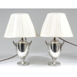 A pair of late Victorian silver two-handled urn pattern table oil lamps (now converted to