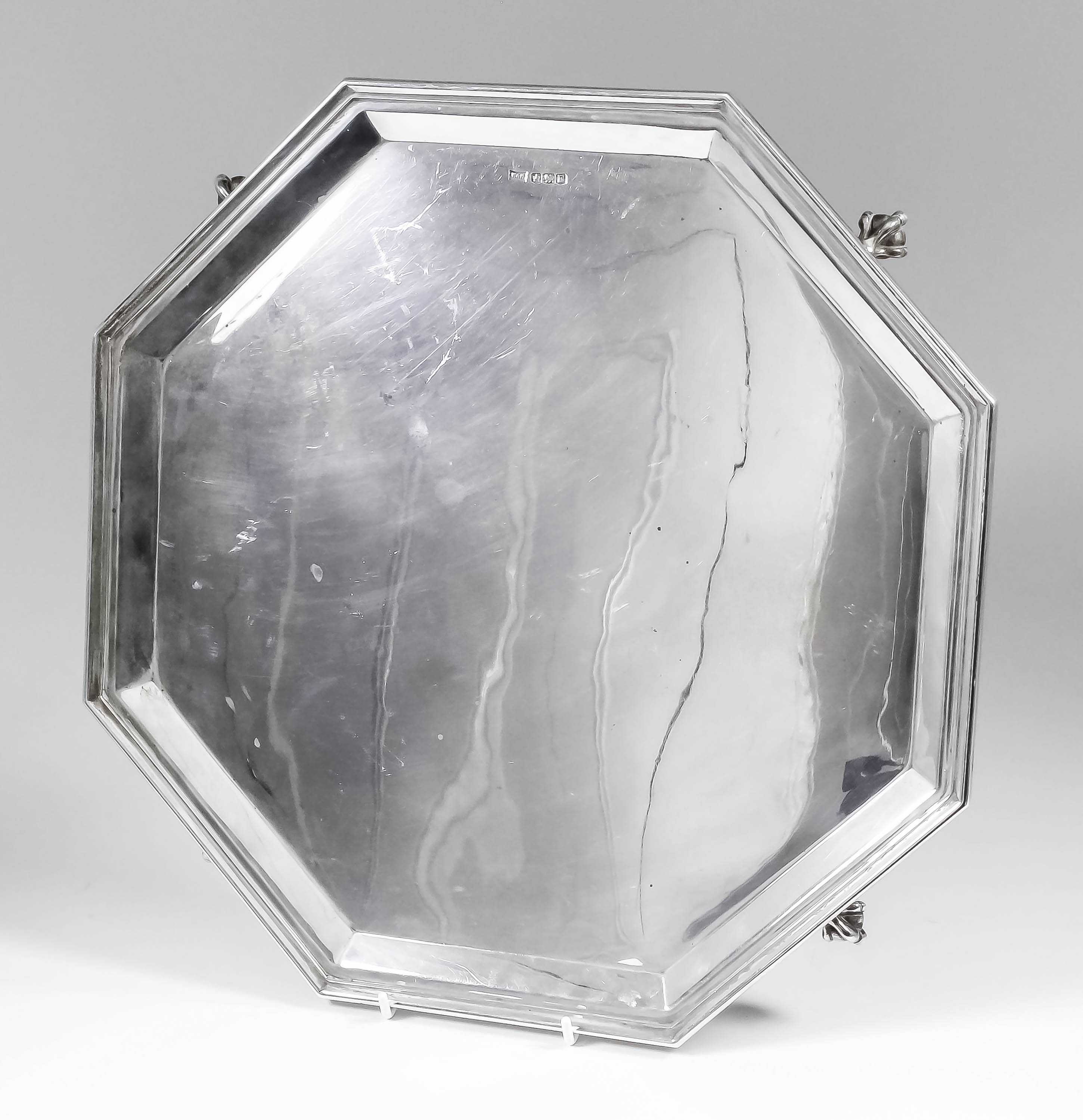 A George VI silver octagonal salver with moulded rim, on four claw and ball feet, 14.25ins wide,