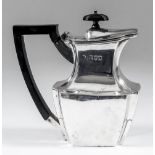 An Edward VII bachelors silver octagonal hot water pot of panelled form, with ebonised finial and