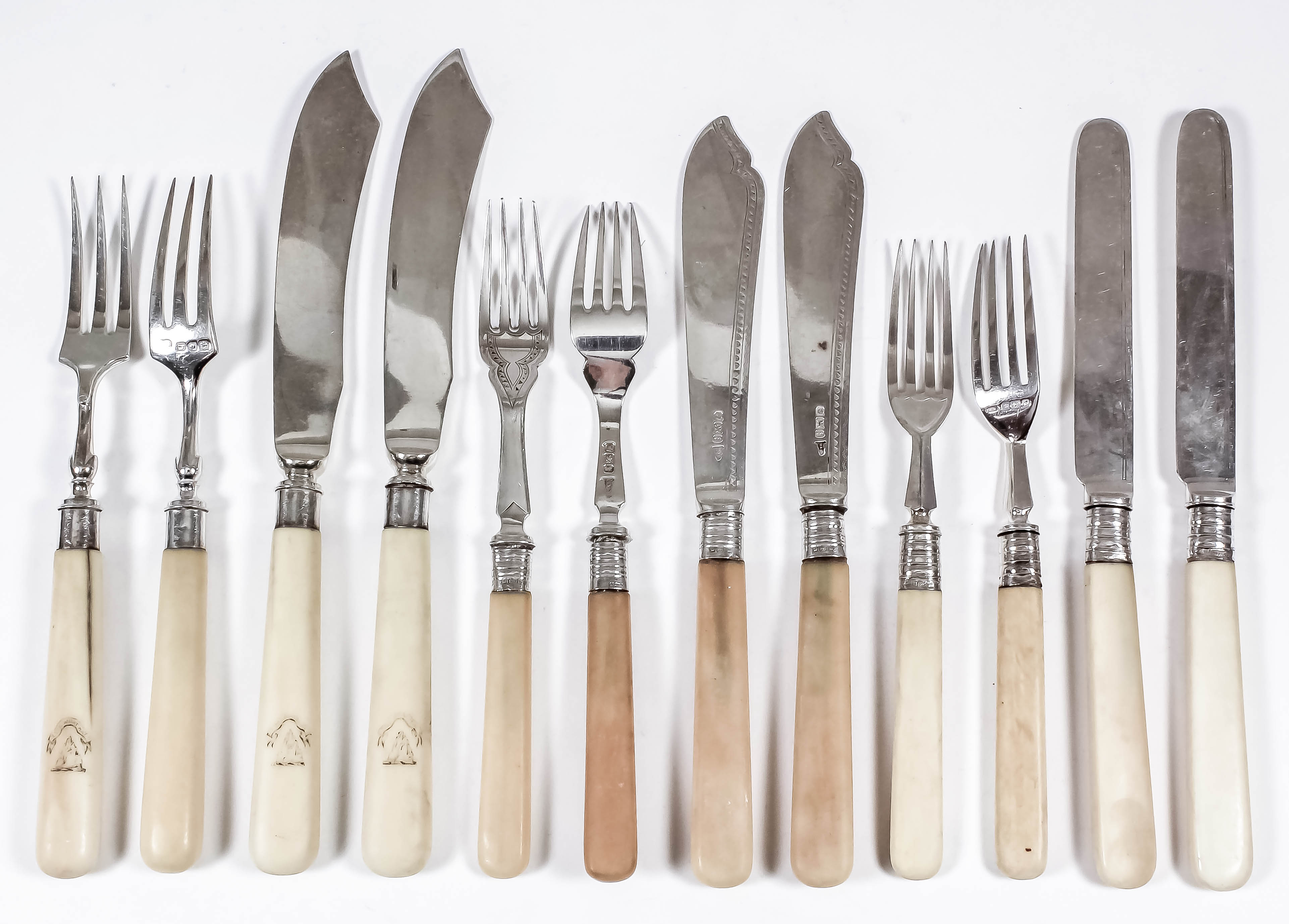 Ten Edward VII silver and ivory handled fish forks and four matching knives by The Goldsmith &