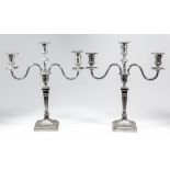 A pair of Edward VII silver pillar candlesticks of "Neo Classical" design, the urn pattern