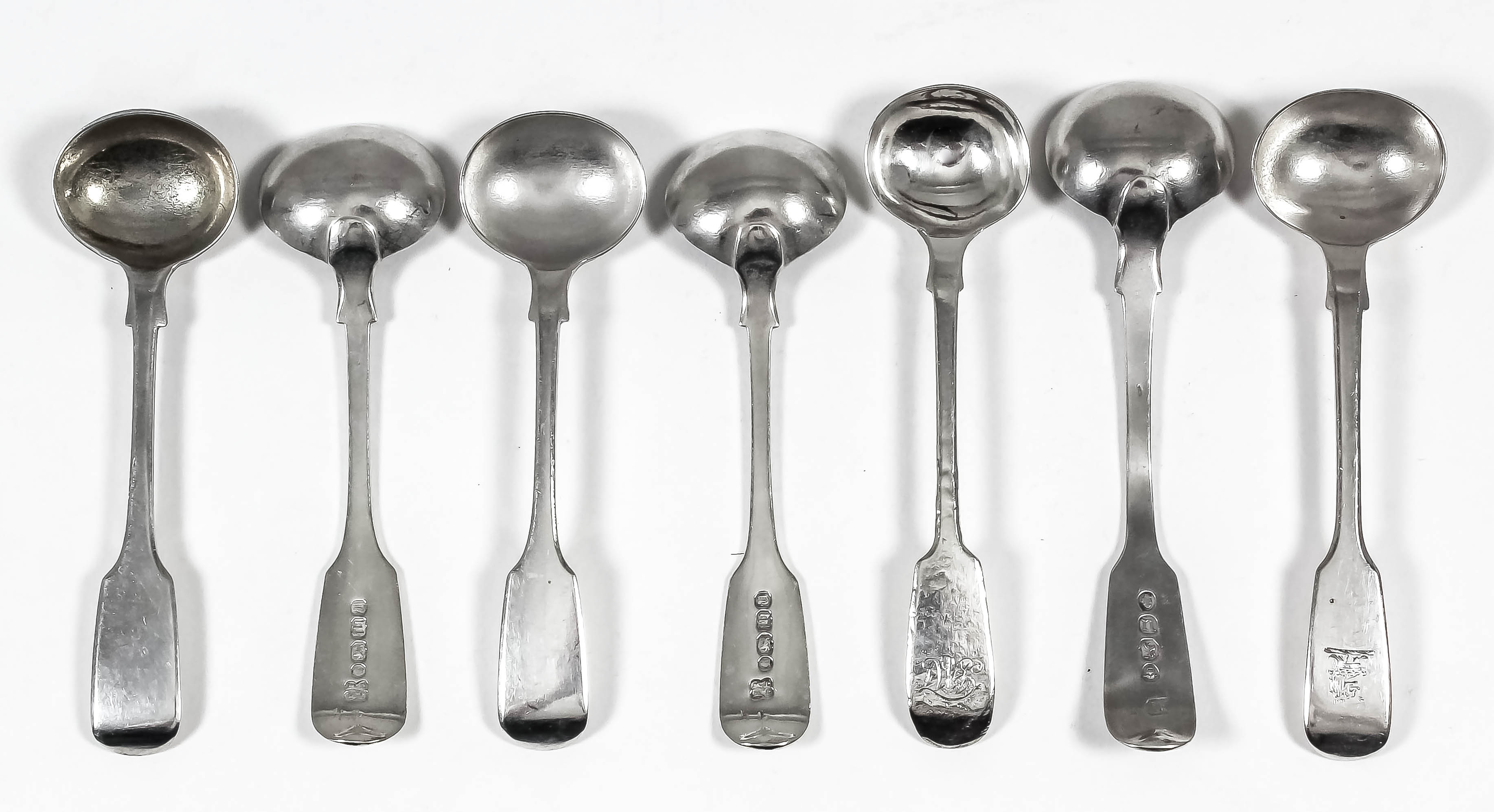 Four Victorian silver fiddle pattern mustard spoons by Josiah Williams & Co, Exeter 1856, and