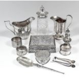 A late Victorian silver oval milk jug with part reeded body and angular loop handle, 4ins high, by