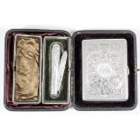 A late Victorian silver rectangular card case, the face freshly engraved with a bird within scrolled