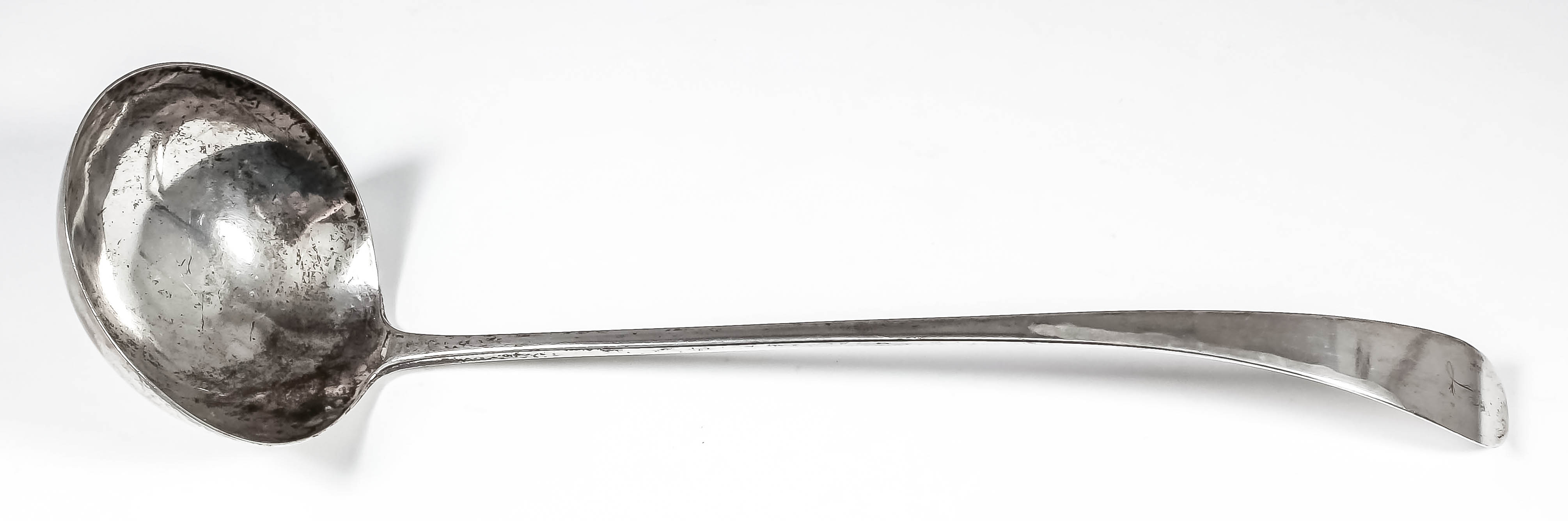 An 18th Century silver soup ladle with plain circular bowl, possibly Newcastle 1736 but incompletely