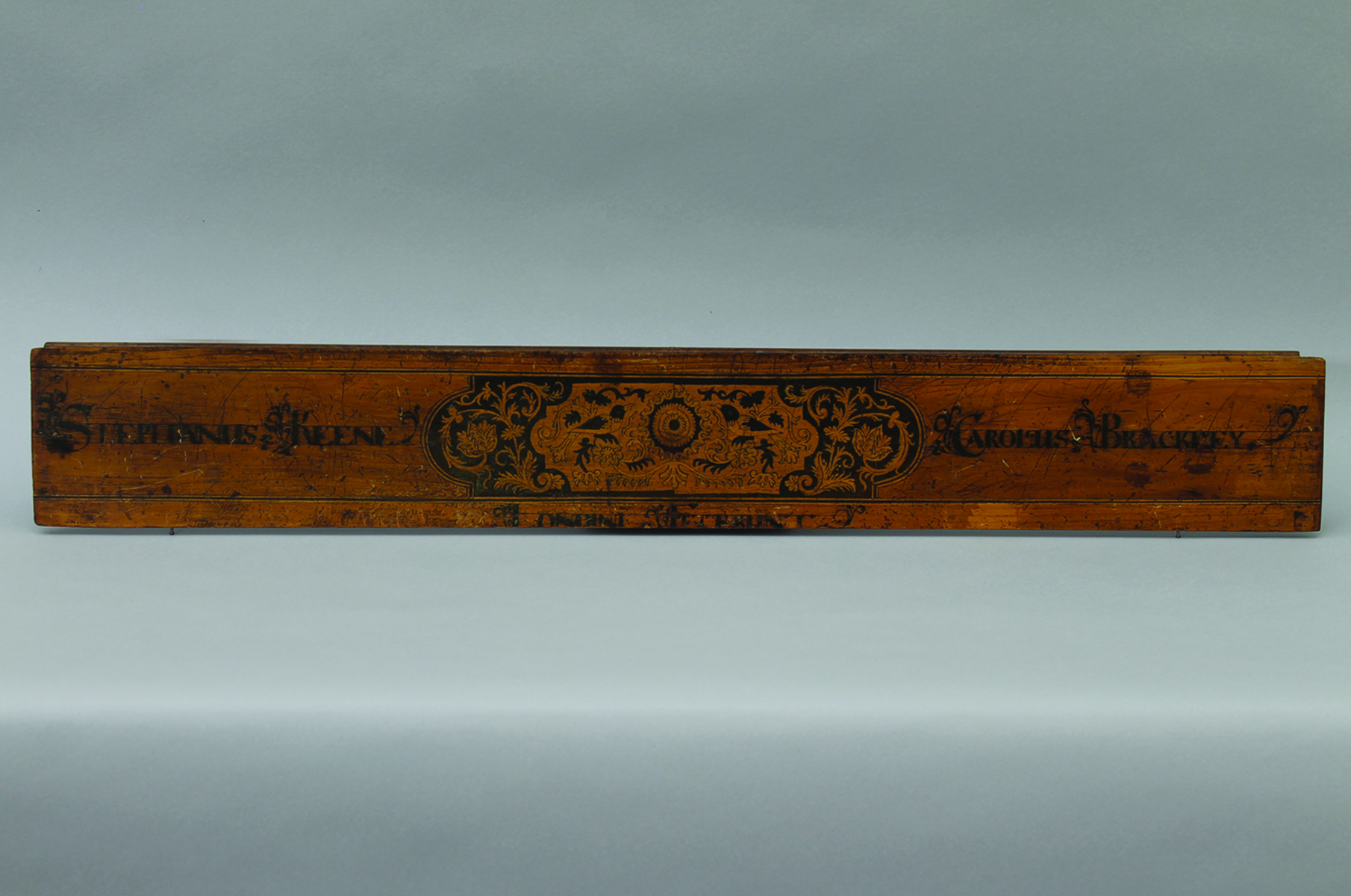 Name-board Fascia A name-board fascia presumed to be circa 1717, from a virginal. Inscribed '