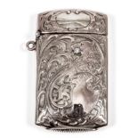 An American gold coloured metal rectangular vesta case, chased and embossed with a heraldic lion and