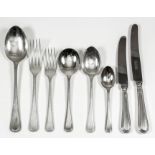 An Elizabeth II silver bead pattern table service for eight place settings, comprising - table