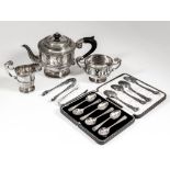 An Edward VII silver circular three piece tea service with moulded rim and girdle to bodies,