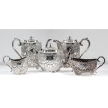 A late Victorian silver oval five piece tea and coffee service, the part reeded bodies chased and