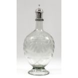 A Continental green tinted glass decanter, the oval body with flattened sides and etched leafy