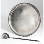 An Elizabeth II silver circular salver with moulded rim, on four panelled feet, 13.75ins diameter,