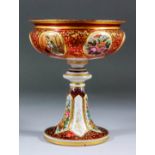 A 19th Century Bohemian ruby glass and white overlay tazza on tall splayed foot, enameled in colours