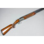 A 12 bore over and under shotgun by Miroku (Model 3000), Serial No. 63567PW, the 28ins blued steel