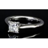 A modern platinum mounted solitaire diamond ring, set with a Princess cut diamond of