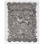 A Near Eastern silvery metal rectangular card case of shaped outline, chased and embossed in bold