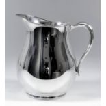 A 20th Century plain sterling silver baluster shaped water jug with scroll handle, 8ins high, by