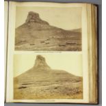 A late 19th/early 20th Century leather bound album, containing a selection of black and white