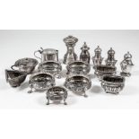 Four Victorian silver circular salts with fluted and reeded rims, the bodies embossed with scroll