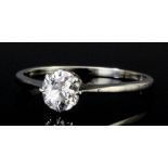 An 18ct white gold and platinum mounted solitaire diamond ring, the old cut stone approximately .