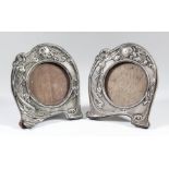 Two George V silver frames of shaped outline in the "Art Nouveau" manner, embossed with a woman,
