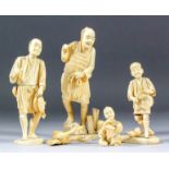 Four Japanese carved sectional ivory Okimono of figures in various pursuits, including man beating