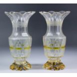 A pair of 19th Century Bohemian amber flashed cut glass vases of slender baluster form with flared