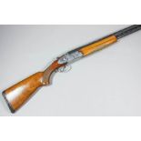 A 12 bore over and under shotgun by Rizzini of Italy, Serial No. 51058, the 27ins blued steel