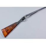 A 12 bore side by side box lock ejector shotgun by J. Patstone, the 28ins blued steel barrels with