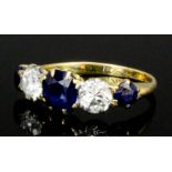 A 20th Century yellow coloured metal mounted sapphire and diamond five stone ring, the three