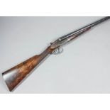 A good 12 bore side by side side lock ejector (self opening) shotgun by Hentry Atkin of London,