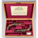 A pair of 19th Century .60 calibre percussion cap travelling pistols by R.S. Clark of London, each