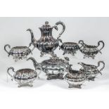 An Elizabeth II silver eight piece tea and coffee service of Victorian design circular lobed form,