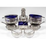 A pair of late Victorian silver oval salts of Neo-Classical design, with reeded rim, pierced sides