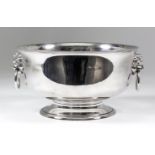 A George V silver circular two handled bowl with reeded rim, lions mask and ring pattern handles