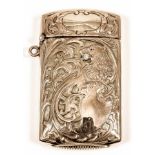 An American gold coloured metal rectangular vesta case, chased and embossed with a heraldic lion and