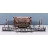 A 19th Century cast iron fire grate with shaped front, shaped and pierced apron and on scroll