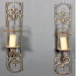 A pair of French painted wrought iron wall brackets with rectangular open work backs, each with a