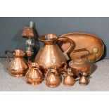 Six Victorian copper measuring jugs - two gallon, half gallon, quarter gallon, pint, half pint,